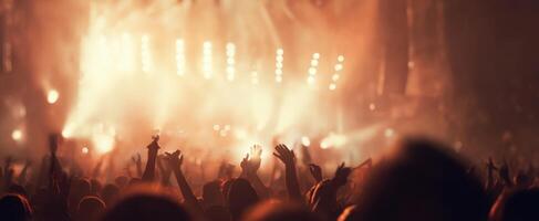 The crowd at a vibrant music festival enjoying an electrifying performance under dazzling lights. photo