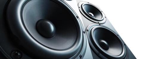 The close-up view of powerful black stereo speakers with bass drivers photo