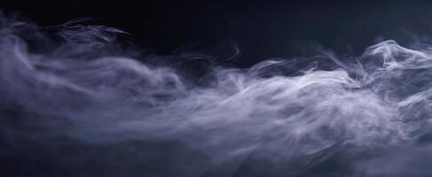 The ethereal beauty of swirling smoke on a dark background. photo