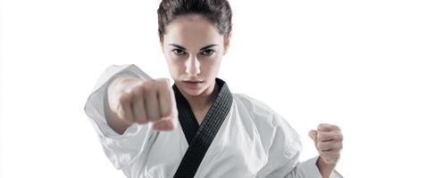 The Female Martial Artist Demonstrating Strength and Focus in a Dynamic Pose photo