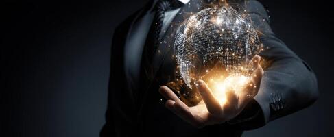 The Businessman Holding a Glowing Digital Globe in His Hand photo