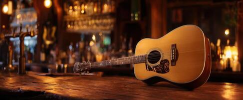 The acoustic guitar resting on a wooden bar in a cozy pub setting. photo