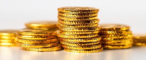 The shimmering stacks of gold coins representing wealth and prosperity photo