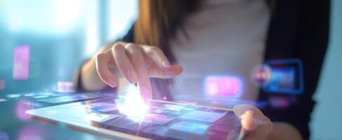 The user interacting with a digital tablet in a modern office environment. photo