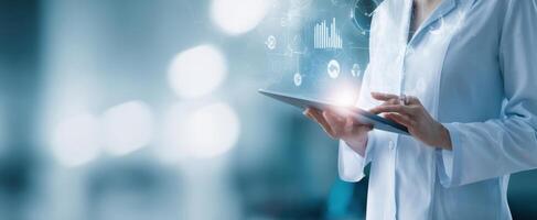 The healthcare professional using a tablet to access digital data analytics. photo