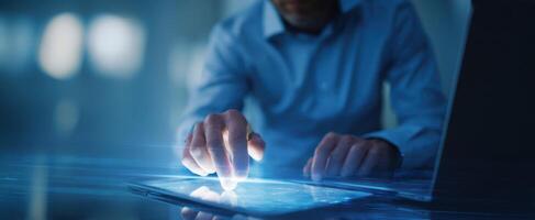 The businessman interacting with a tablet in a modern digital workspace. photo