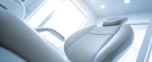 The modern dental chair in a bright and inviting dental clinic. photo