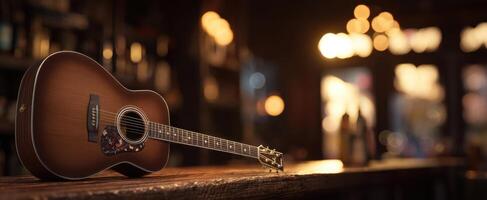 The acoustic guitar resting elegantly on a rustic bar counter in warm ambiance. photo