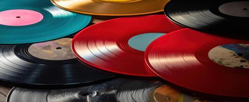The vibrant collection of colorful vinyl records on a rustic background. photo