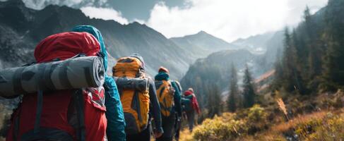 The adventurous hikers journeying through a breathtaking mountain landscape. photo