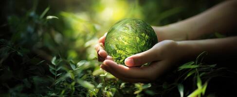 The Green Globe Representing Nature's Beauty and Sustainability in Hands photo