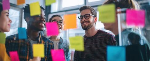 The group of young professionals collaborating with colorful sticky notes. photo