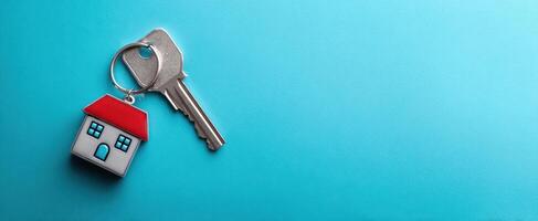The key and house symbolizing new beginnings and home ownership. photo