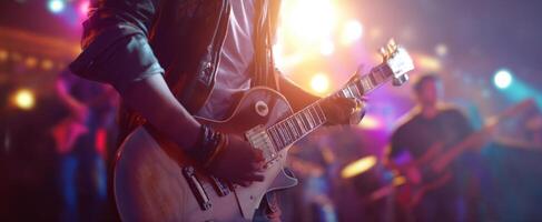 The guitarist captivating the audience with electrifying live performance. photo