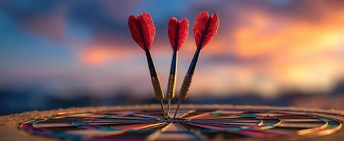 The vibrant darts poised on a colorful target against a stunning sunset backdrop. photo