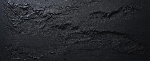 The textured black surface with abstract patterns and modern elegance. photo