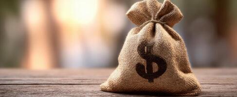 The burlap sack filled with money symbolizing wealth and prosperity photo