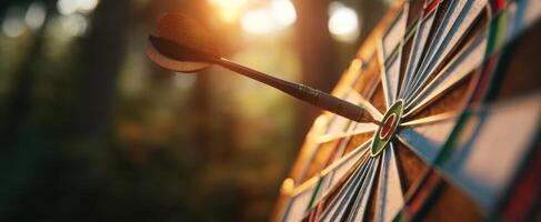 The dart striking the bullseye on a vibrant outdoor dartboard. photo