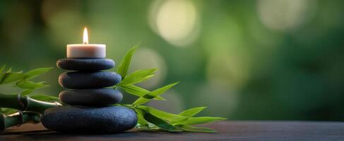 The serene composition of stones, bamboo, and candlelight for relaxation. photo