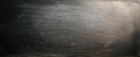 The textured metallic surface with scratches and a dark gradient. photo