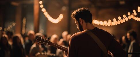 The musician captivating the audience with a soulful guitar performance. photo
