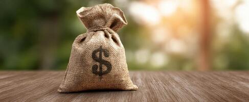The burlap money bag symbolizing prosperity and financial success. photo