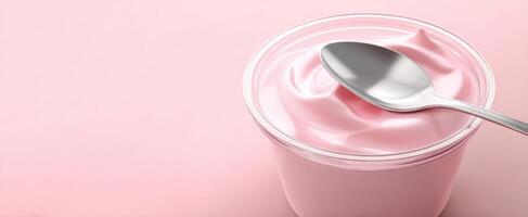 The creamy pink yogurt in a stylish bowl with a sleek spoon. photo
