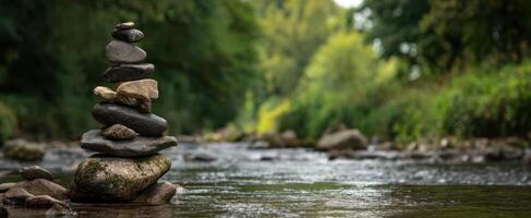 The stacked stones create a serene focal point along the flowing river. photo