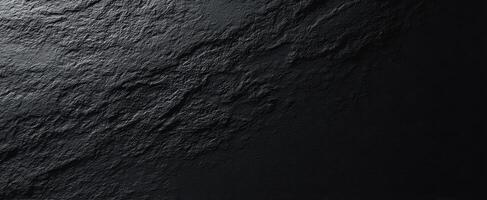 The textured black stone surface with intricate patterns and a modern aesthetic. photo