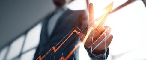 The business professional illustrating growth with a rising chart in a modern office. photo