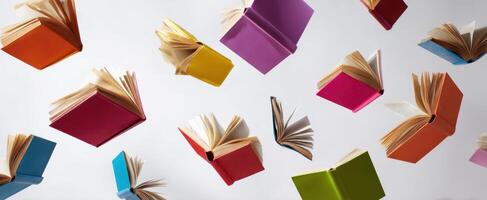 The vibrant books soaring through the air with pages open and colors vivid. photo