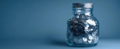 The jar filled with coins representing savings and financial growth. photo