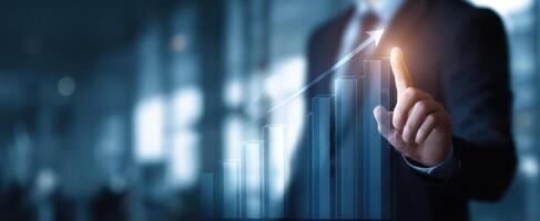 The business professional analyzing growth trends with a digital chart. photo