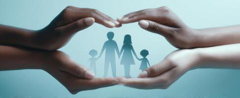 The hands of protection surrounding a diverse family silhouette in unity. photo
