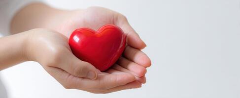 The Hands Holding a Heart Symbolizing Love and Compassion in Relationships photo