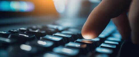 The finger pressing keys on a modern keyboard in a vibrant workspace. photo