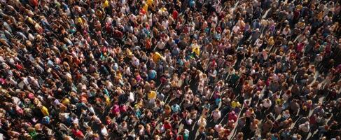 The vibrant crowd uniting in a lively urban celebration beneath the sun photo