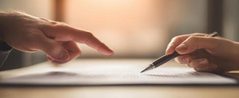 The Close-Up Interaction of Hands Over a Document for Agreement photo