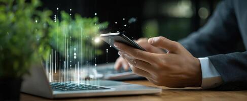 The smartphone displaying data trends in a modern office environment. photo