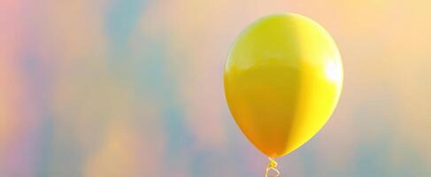 The bright yellow balloon floating against a dreamy colorful background. photo