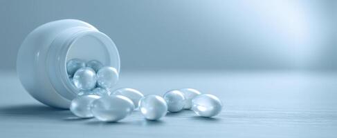The elegant capsules spilling from a white medicine container on a blue background. photo
