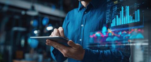 The professional using a tablet for analyzing digital business data and trends. photo