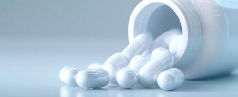 The white pills and bottle spilling on a smooth surface. photo