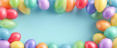 The colorful balloons creating a cheerful frame on a blue background. photo