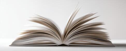 The open book showcasing its pages in an elegant presentation on a white background. photo