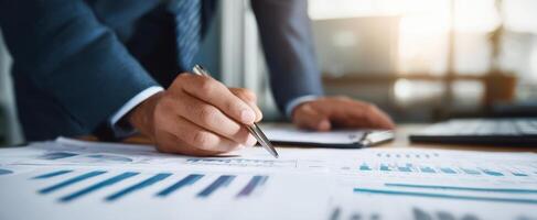 The professional analyzing business reports while preparing strategic recommendations. photo