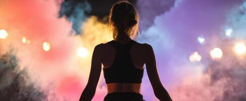 The woman embracing vibrant colors amid a captivating smoky backdrop photo