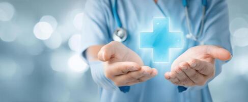 The healthcare professional offering a holographic medical cross in hands. photo