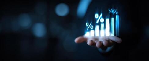 The hand holding a digital growth chart with percentages and market insights. photo