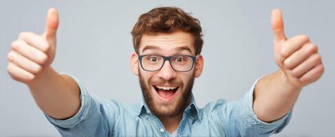 The cheerful young man giving a thumbs-up in a casual setting. photo